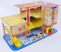 GARAGE: A charming vintage ' TW Toys ' made wood and plastic children's toy model garage.