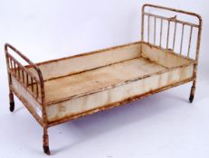 EDWARDIAN DOLLS BED; An unusual large early 20th century Dolls / Bears toy bed,