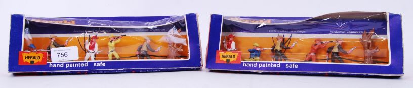 HERALD: A pair of vintage Britains Herald 4606 Cowboys plastic model cowboys.