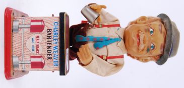 CHARLEY WEAVER: An original vintage battery operated tin plate ' Charley Weaver Bartender .
