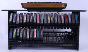 ATARI; A fabulous vintage retro Atari VCS games console, games and rare storage stand.