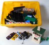 SCALEXTRIC: A crate of assorted vintage Scalextric parts to include various bits, cars,