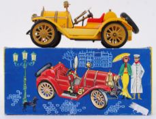 SCHUCO: A Schuco tinplate ' Old Timer ' clockwork model car. Within the original box.