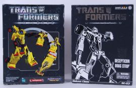 TRANSFORMERS: Two Transformers Universe ' Drag Strip ' action figures.