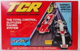 TCR: A vintage TCR Total Control Racing electric Scalextric style racing set.
