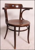 A Bentwood 1930's cafe chair having embo