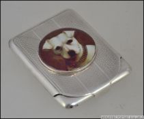 A hallmarked silver card case, with enam