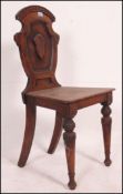 A Victorian mahogany hall chair raised o