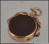 A 9ct bloodstone agate and swivel pendan