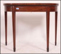 A Georgian mahogany inlaid demi - lune c