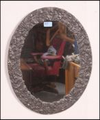 A decorative 20th century pewter framed