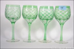 A set of 4 Bohemian green flashed wine g