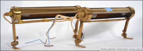 A pair of quality brass picture lights o