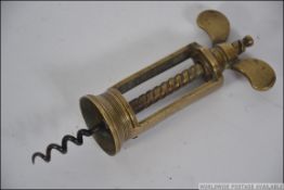 A Victorian brass corkscrew of Farrow &