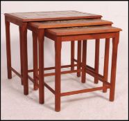 A Danish 1970's tile top nest of tables