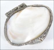 A silver white metal and mother of pearl