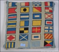 An early 20th century cushion having han