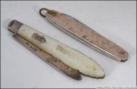 A silver hallmarked fruit knife with mot