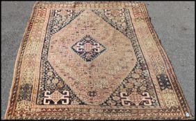 A Persian / Iranian floor rug, red groun