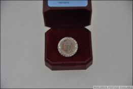 Two white metal rings , one with a slive