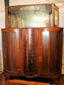 A 1950's walnut display cabinet with rev