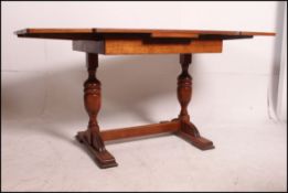 A 1930's Art Deco oak draw leaf refector