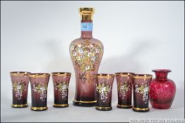 A Bohemian hand painted set with decante