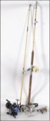 A collection of fishing reels to include