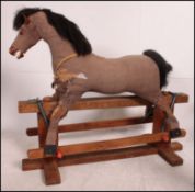 An Ayres style 20th century rocking hors