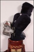 A collection of golf clubs all contained