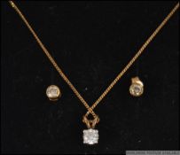 A 9ct gold and diamond necklace pendant