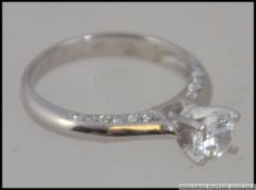 A silver 925 white metal and CZ engageme