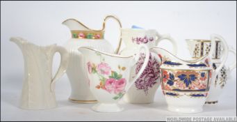 A collection of creamers to include Roya