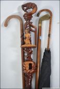 A collection of walking canes to includ