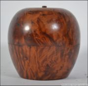 A Georgian style olive wood tea caddy in