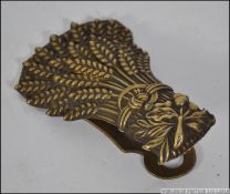 A Victorian brass letter clip by Whiteho
