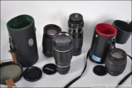 A collection of camera lenses to include