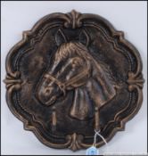 A cast iron exterior bronze effect horse