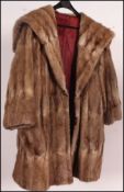 A collection of 3 fur coats dating to th