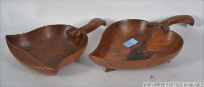 A large wooden dish in the form of a lea