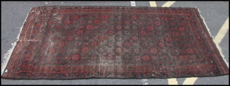 A large Persian type floor rug decorated
