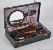 A vintage cased vanity set, appearing to