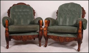 A 20th century carved hardwood pair of a
