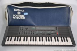 A retro cased portable Yamaha keyboard