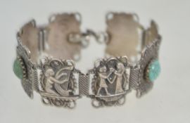 A 1920's Egypian revival bracelet set with moulded turquoise glass cabochons.