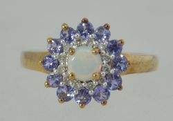 A 9ct gold / 375 marked amethyst and opal ladies dress ring.