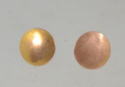 A pair of hallmarked 9ct gold dress shirt studs. Hallmarked for Chester 1910. Weight .9g.
