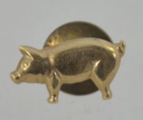 A 9ct gold brooch pin stud in the form of a pig marked 9ct. Pig tests 9ct gold fstner is base metal.