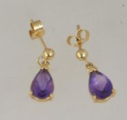 A pair of 9ct gold and amethyst earrings with post backs.