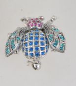 A vintage silver tone rhinestone set bug brooch with roller clasp. Measures 3.5cms.